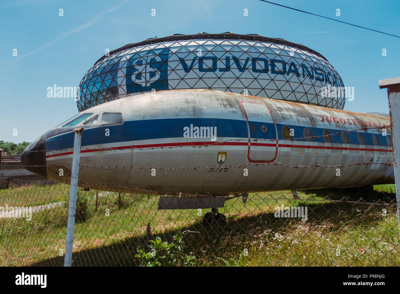 A neglected Sud-Aviation SE-210 Caravelle of JAT Airways, in front of the dome of Aeronautical Museum Belgrade, Serbia Stock Photo