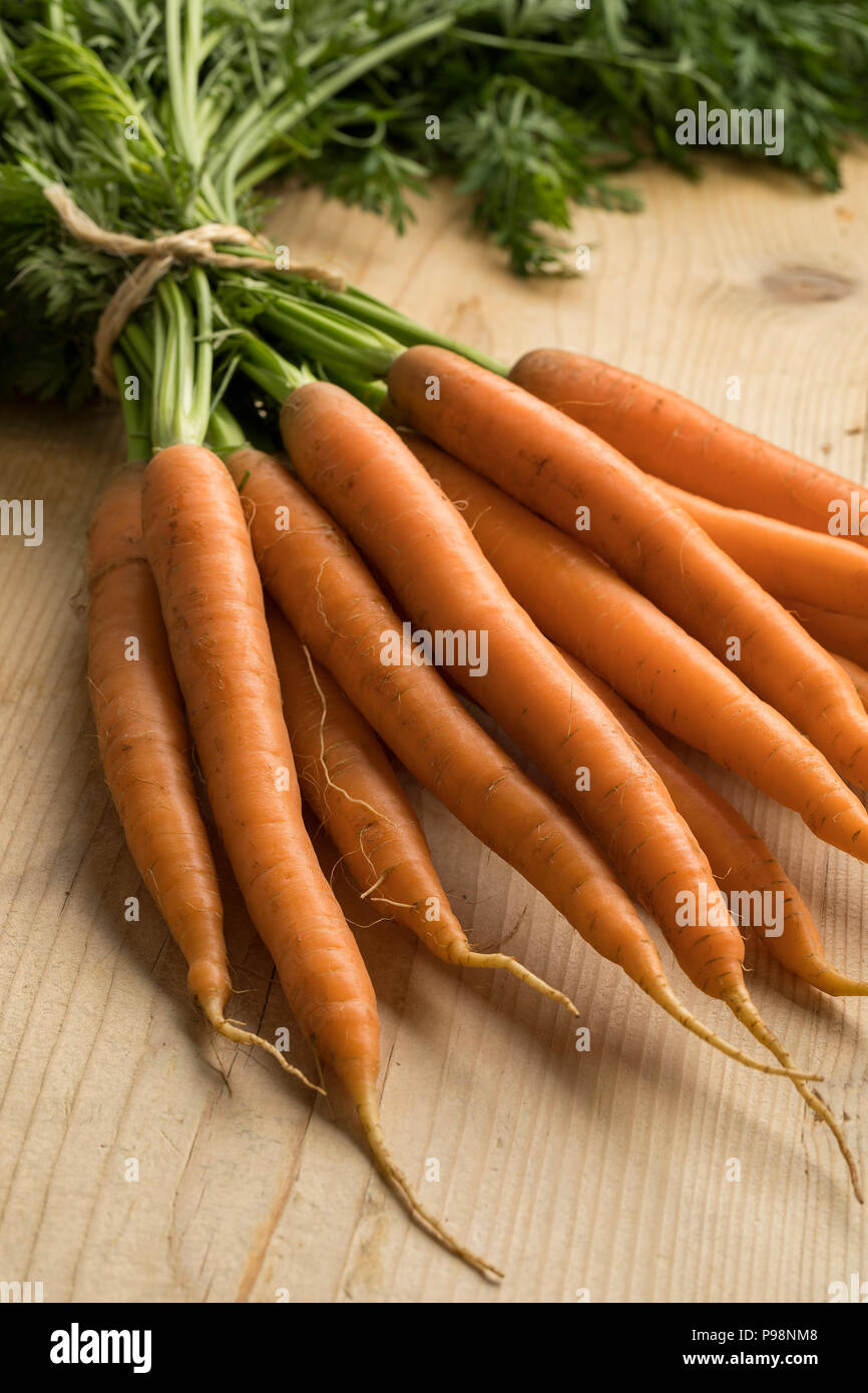 Bunch of fresh picked whole carrots close up Stock Photo