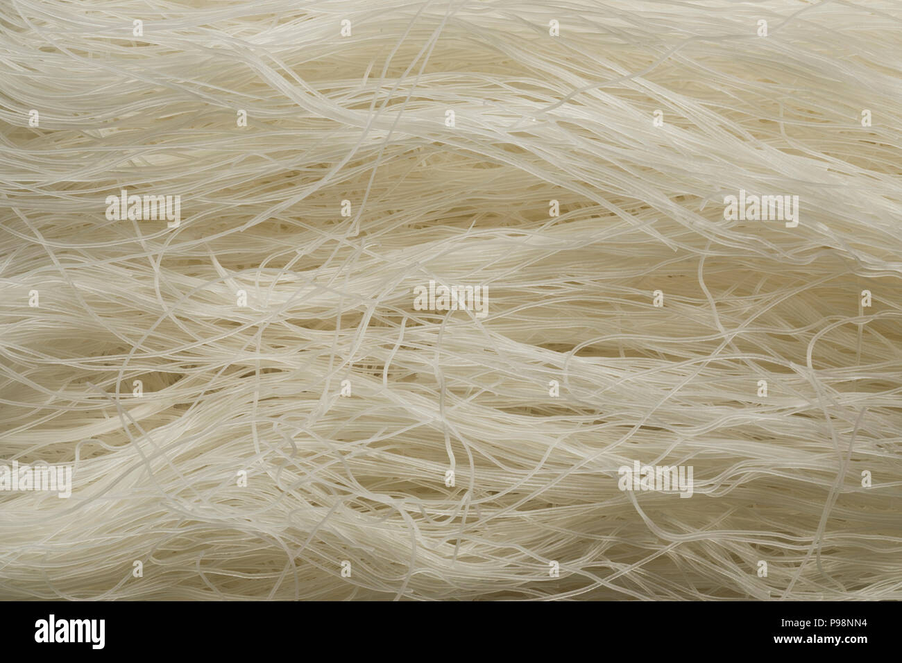 Raw white rice noodles close up full frame Stock Photo