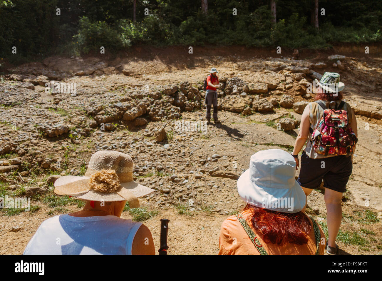 A guide speaks to a tour group at the Pyramid of the Sun, a controversial spiritual / astrological tourist attraction in Bosnia and Herzegovina Stock Photo