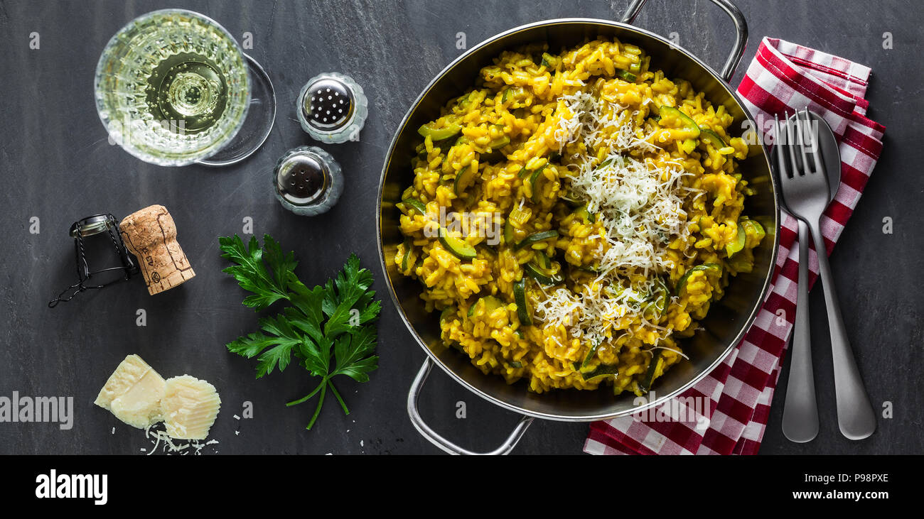 Yellow Rissotto banner of Italian dish yellow Risotto milanese with saffron, zucchini ...