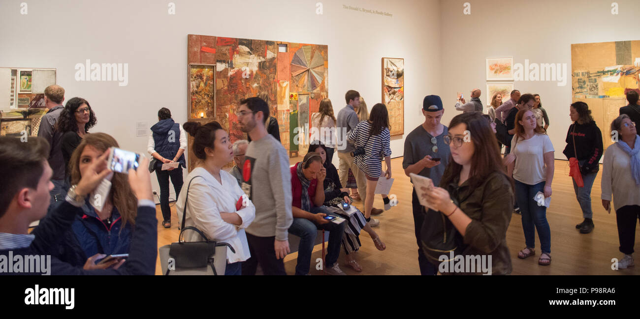 Visitors crowd the Robert Rauschenberg retrospective at the Museum of Modern Art (MoMA), August 2017. Stock Photo
