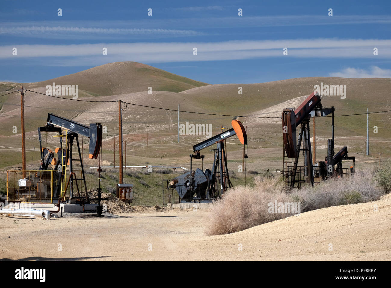 Busy pumpjacks at work in the Sunset-Midway oil field in kern county california Stock Photo