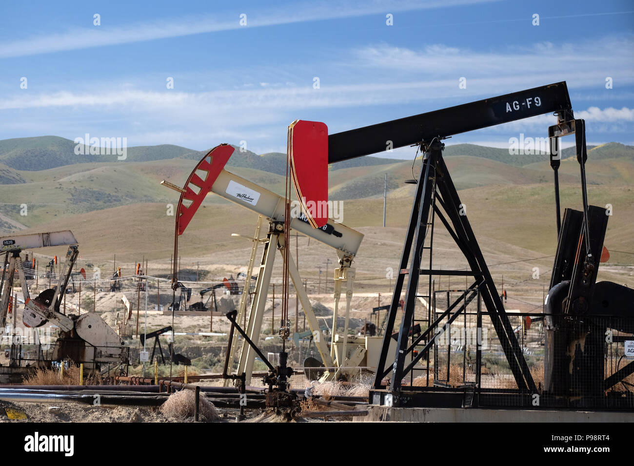 Busy pumpjacks at work in the Sunset-Midway oil field in kern county california Stock Photo
