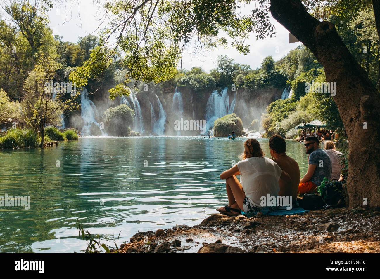 Kravica waterfall - a tufa cascade in Bosnia and Herzegovina, attracts many tourists for a refreshing dip to escape the summer heat Stock Photo