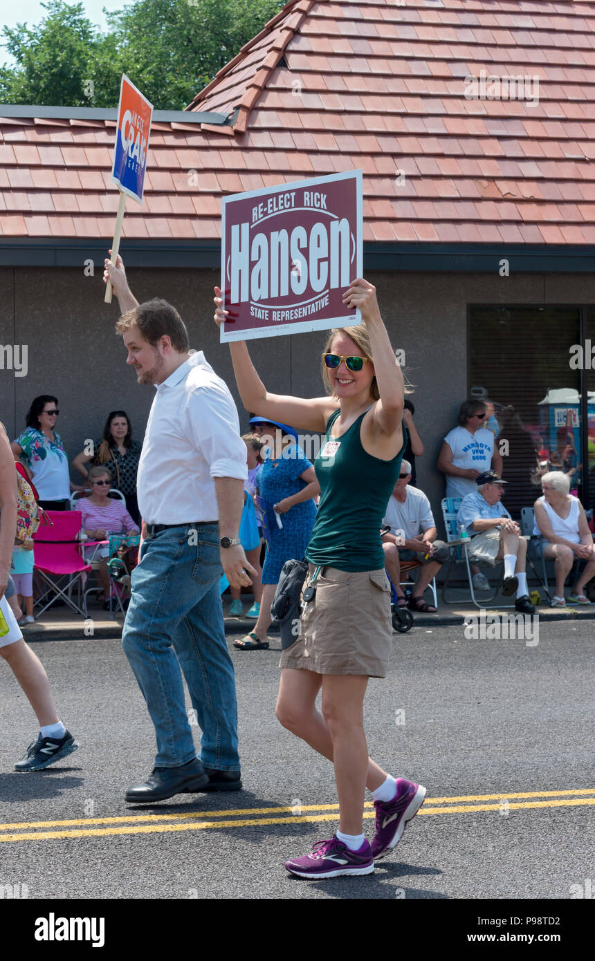 Mendota, Minnesota/USA – July 14, 2018: Supporters of candidates Rick Hansen and Angie Craig march during annual Mendota Days parade. Stock Photo