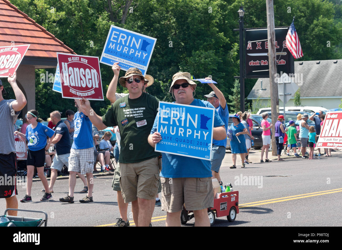 Mendota, MN/USA – July 14, 2018: Supporters of candidates Erin Murphy and Rick Hansen hold signs and march during annual Mendota Days parade. Stock Photo