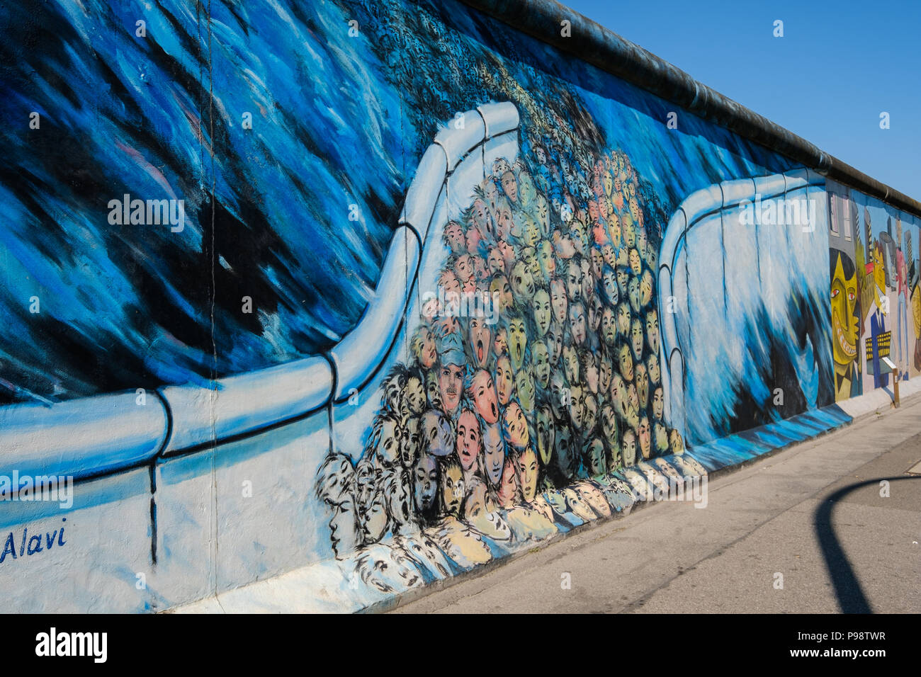 Berlin, Germany - july 2018: Mural painting of Kani Alavi - 'It happened in November' (german: 'Es geschah im November') at Berlin Wall / East Side Ga Stock Photo