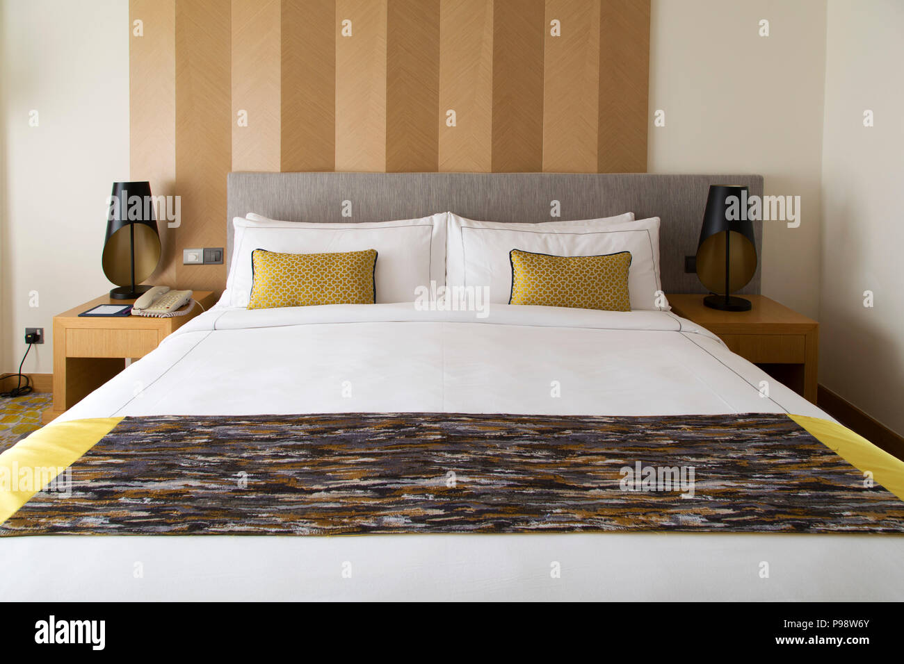 Bed in a bedroom at the Cinnamon Grand Hotel in Colombo, Sri Lanka. The