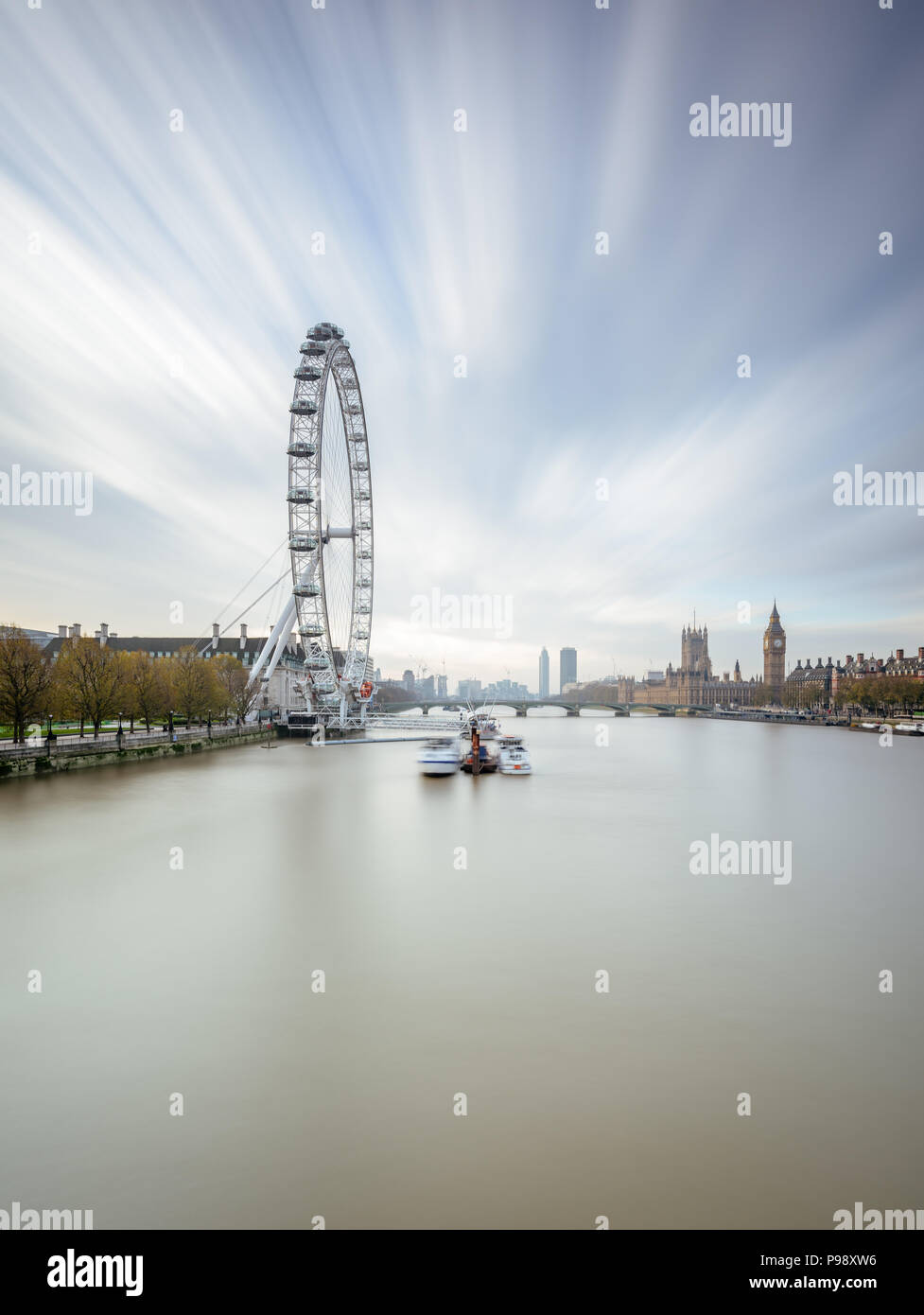 Long exposure portrait view from Hungerford Bridge, London, towards the Coca-Cola London Eye, Westminster Bridge, Big Ben and Houses of Parliament Stock Photo