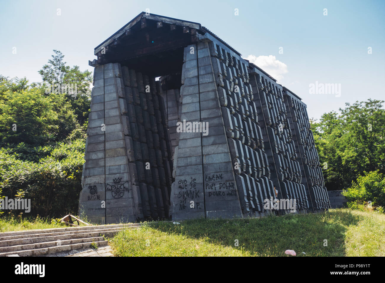 the dark concrete slabs of the Yugoslav-era Mausoleum of Struggle and Victory, Čačak, Serbia Stock Photo