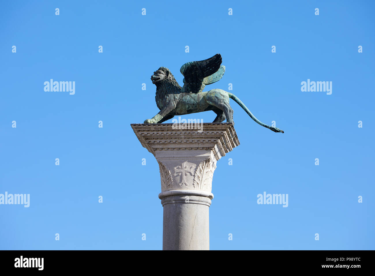 Winged Lion statue, symbol of Venice in a sunny day, blue sky in Italy Stock Photo