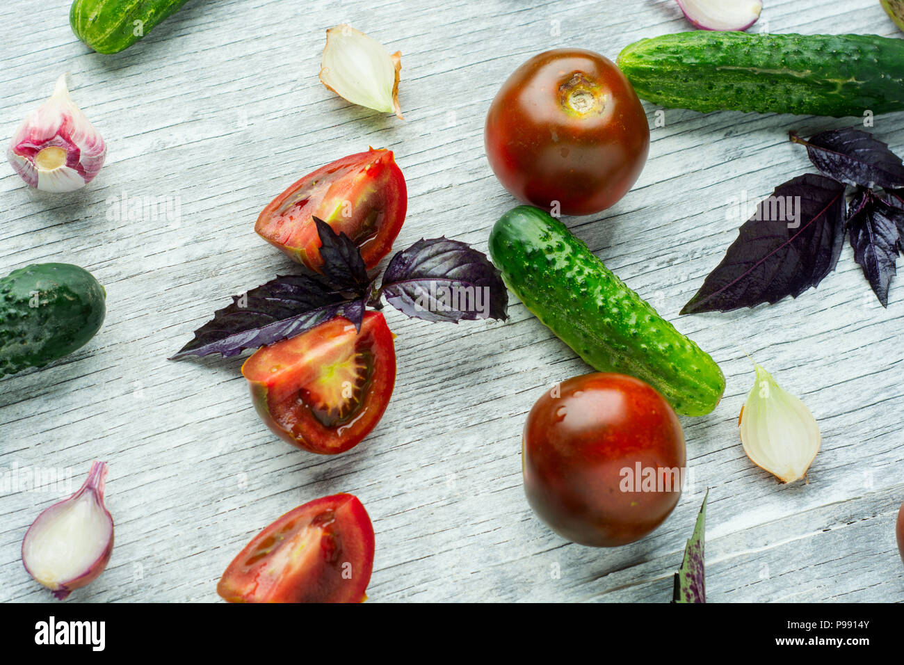 Collection of fresh organic vegetables on white wooden table. Top view ...