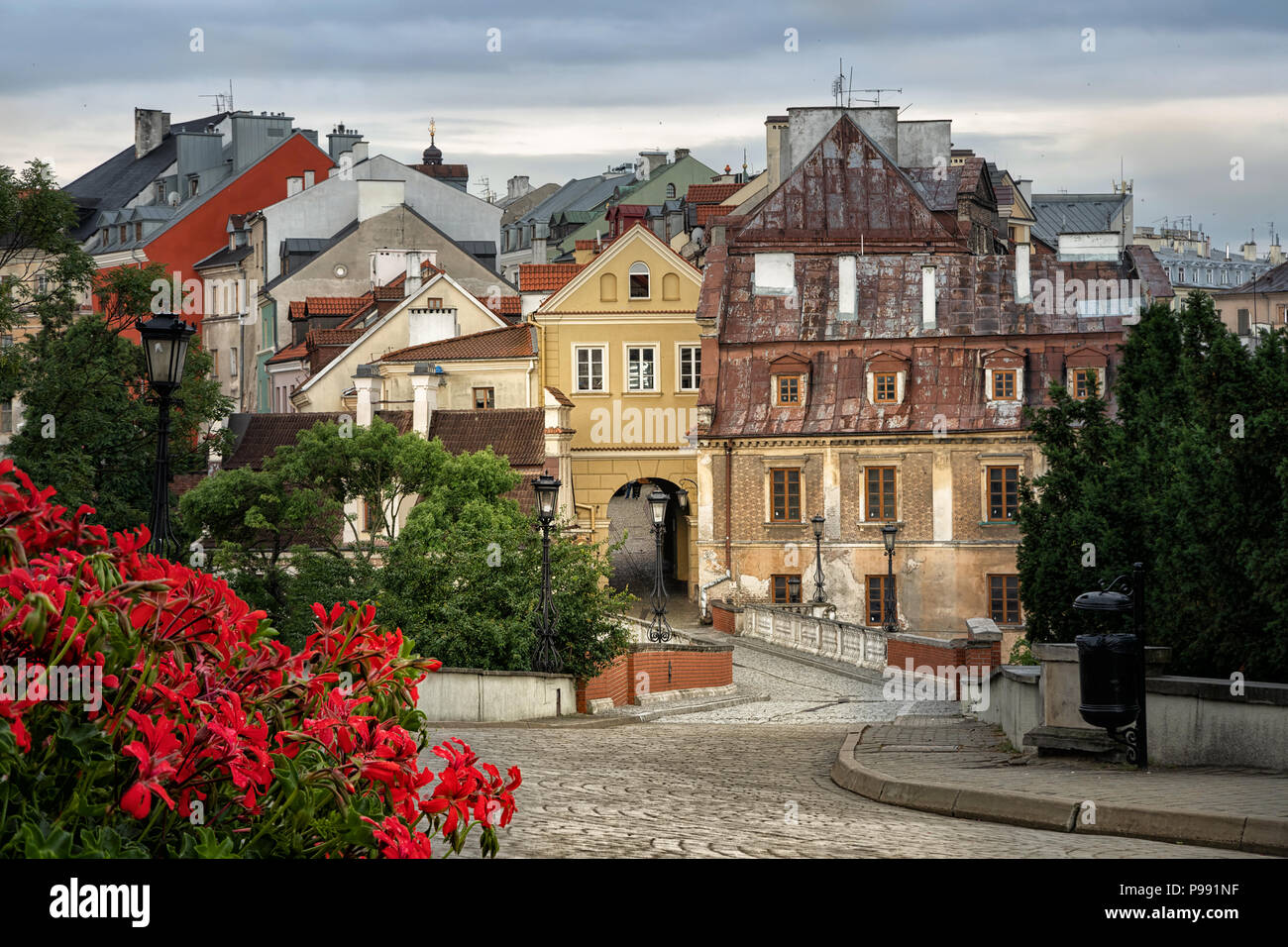 View of old town of Lublin from Lublin Castle with red flowers on foreground, Poland Stock Photo