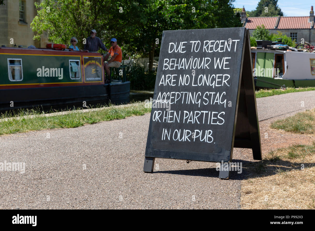 BATH, UK - JUNE 30, 2018 : A chalkboard sign outside a public house on the Kennet and Avon Canal notifying stag and hen parties they are no longer all Stock Photo