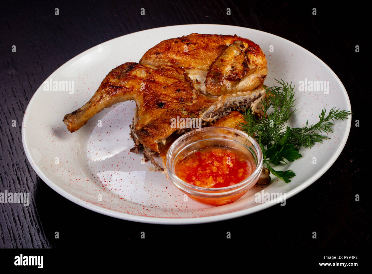 chicken tobacco Tasty tobacco chicken with chili sauce Stock Photo