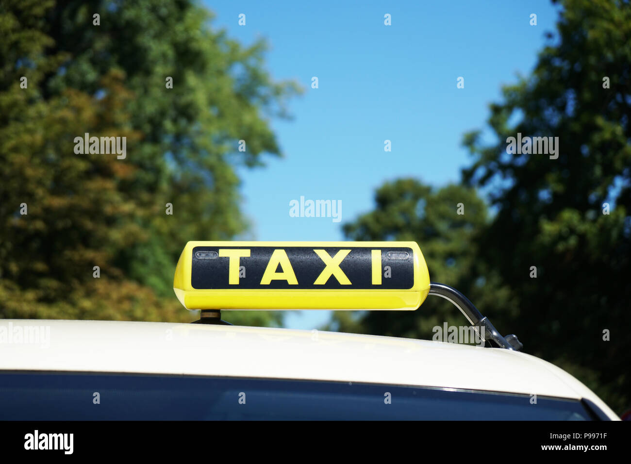 german taxi sign on car roof in Germany, travel transport concept background with copy space Stock Photo