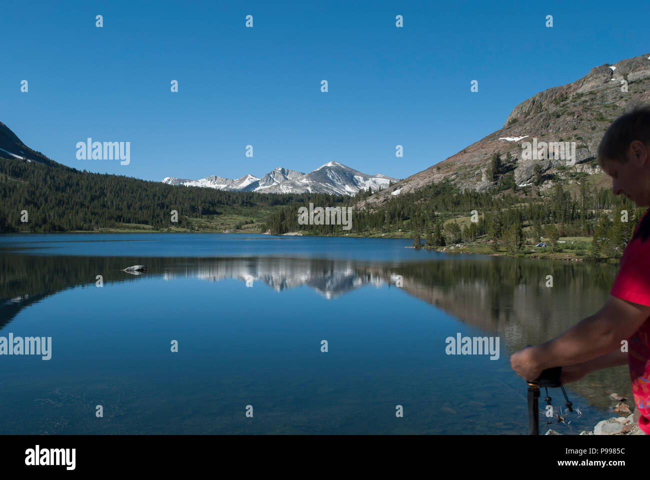 Professional photographer taking shot of the beautiful mountains ...
