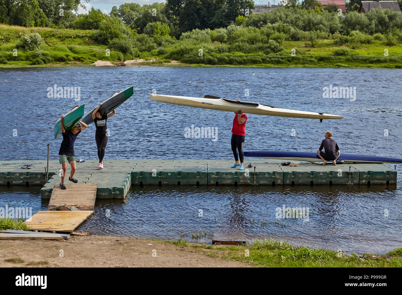 Polotsk, Belarus - July 6, 2018:  Teenagers finished sports training to canoeing and kayaking on river of western Dvina. Stock Photo