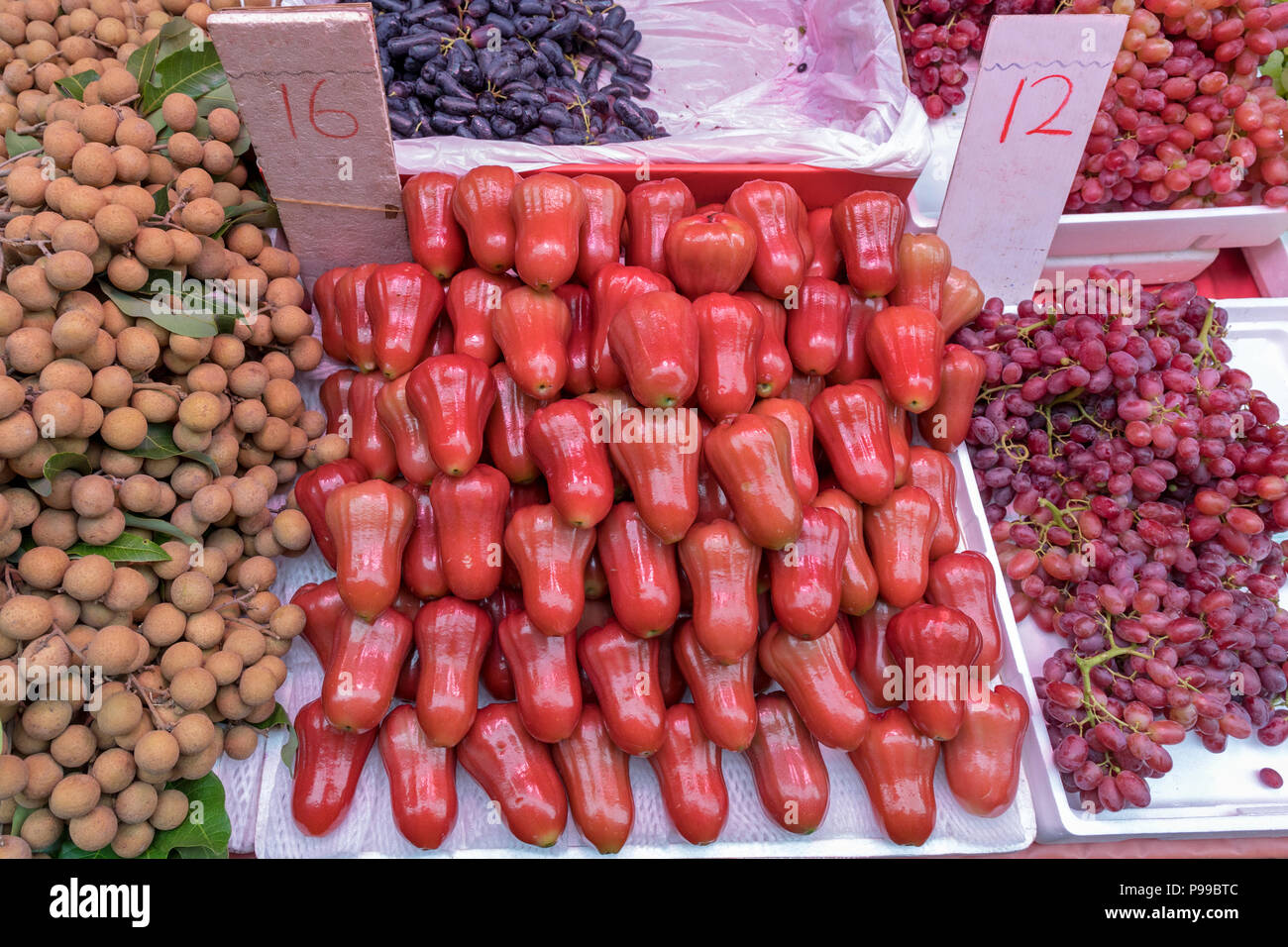 Big Pile of Frsh Rose Apples at Market Stock Photo