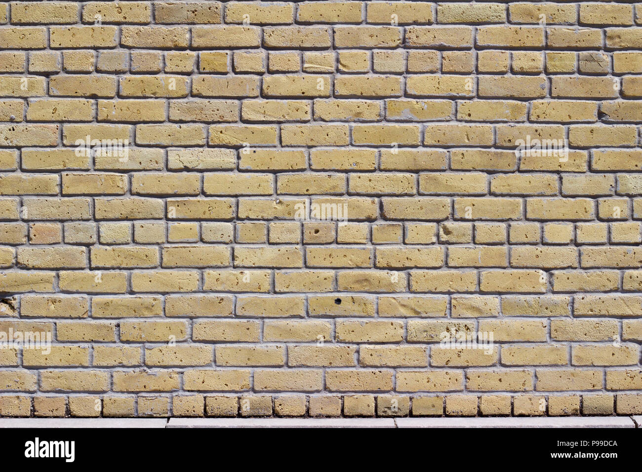 Rustic old white beige brick wall background in common bond pattern with grunge look Stock Photo