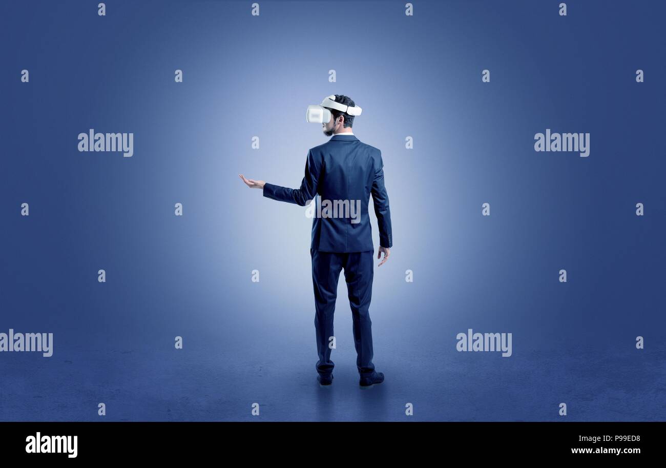 Businessman wearing vj glasse in an empty room with no wallpaper Stock ...