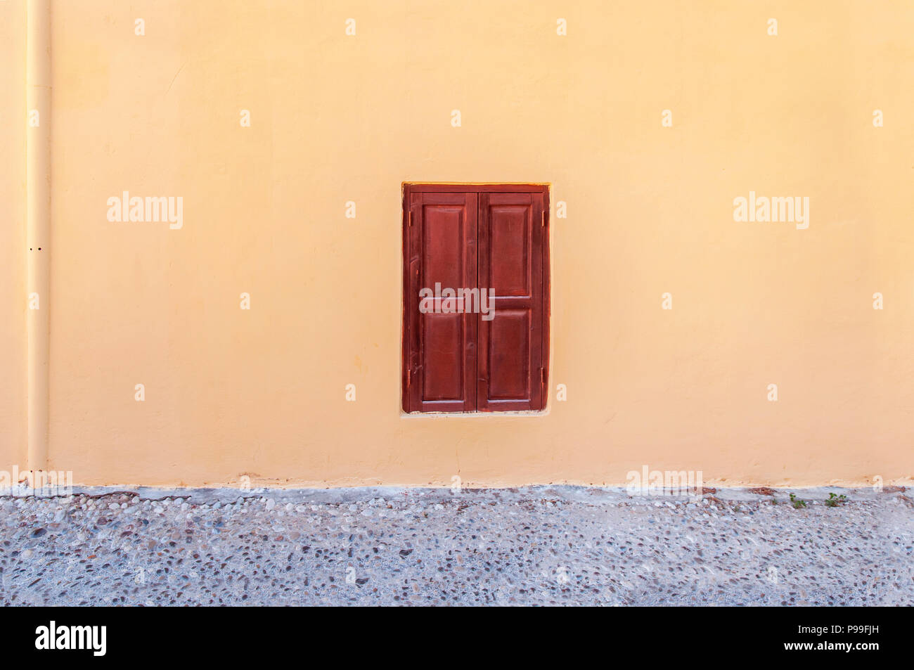 Modern Closed Dark Red Wooden Window On Yellow Cement Textured