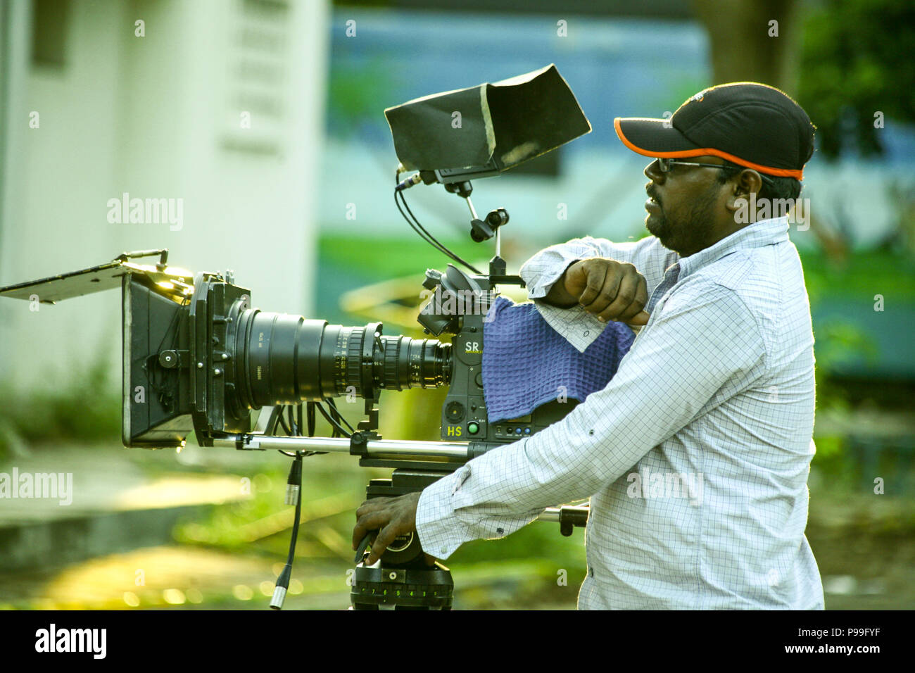 cameraman-shooting-the-film-scene-with-camera-in-film-studio-stock-photo-alamy