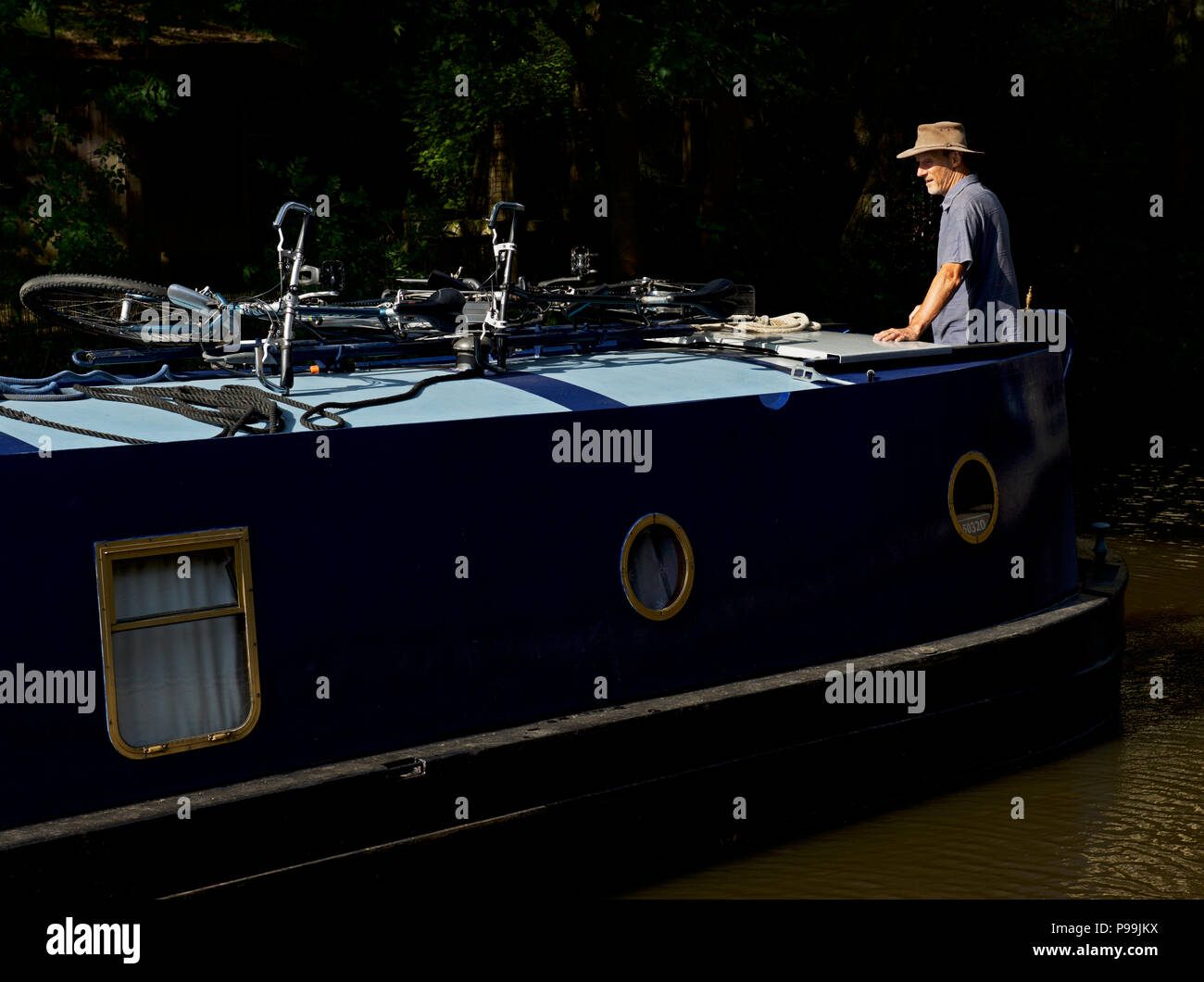 Steering narrowboat hi-res stock photography and images - Alamy
