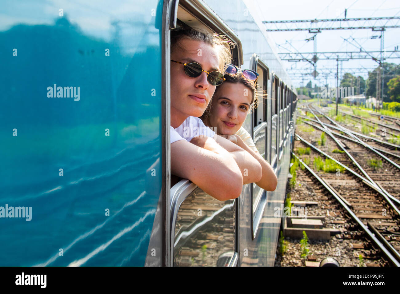 Young European touriust couple pulling into Zagreb, Croatia Stock Photo