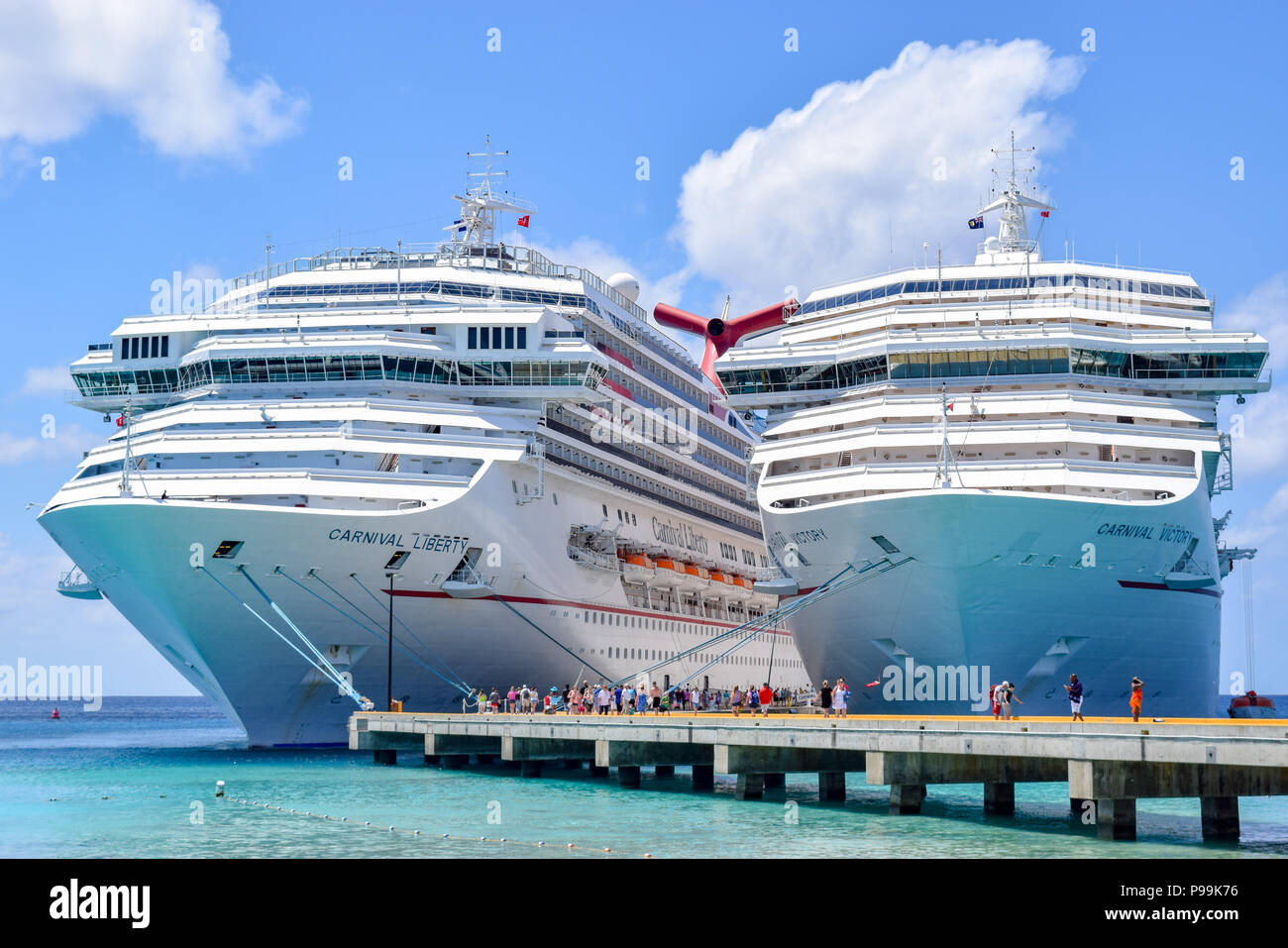 Grand Turk, Turks and Caicos Islands - April 03 2014: Carnival Liberty and Carnival Victory Cruise Ships moored side by side. Stock Photo