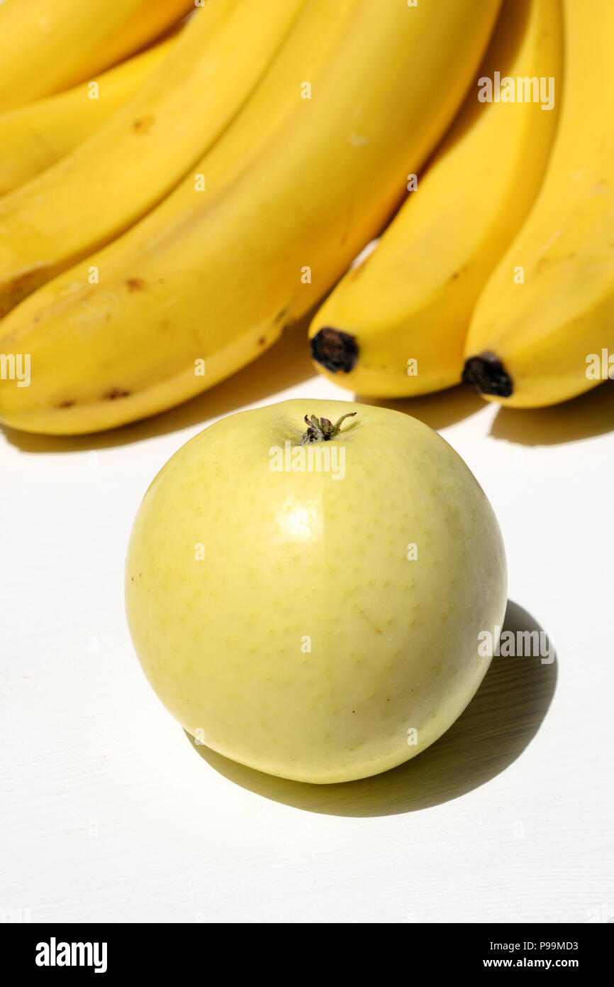 Apple and bananas on a white background Stock Photo Alamy
