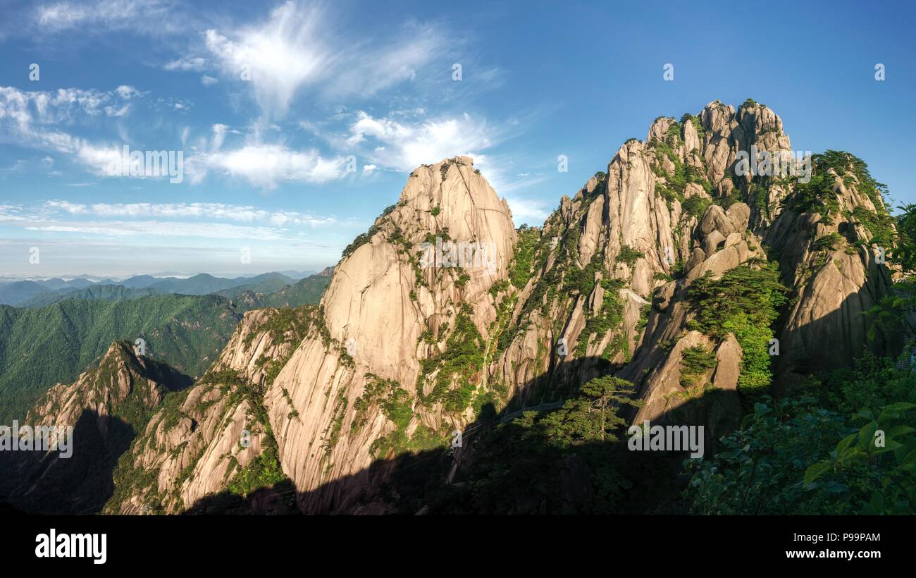 Lotus peak in the very early morning in famous Huangshan ('Yellow mountains'), Anhui, China. Yuping cable car visible at the bottom. Stock Photo