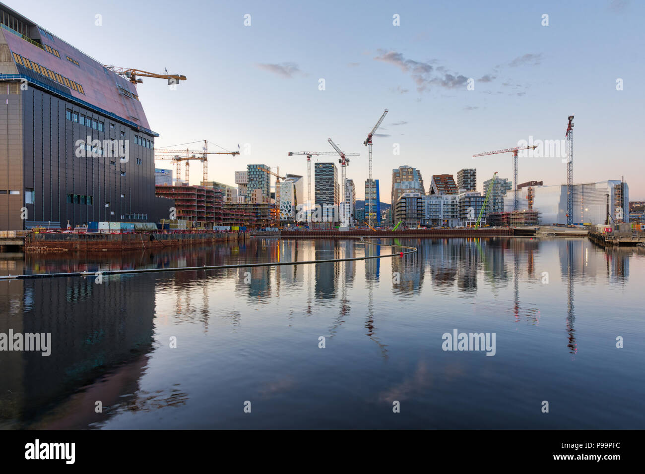 Modern buildings known as Barcode Project under construction in the center of Oslo at the sunset Stock Photo