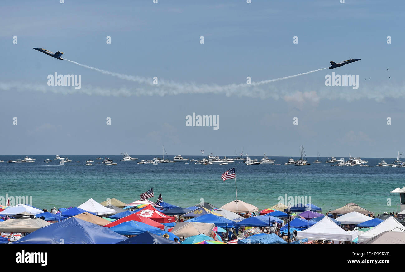 180714-N-ZC358-1270 PENSACOLA BEACH, Fla. (July 14, 2018)   The U.S. Navy Flight Demonstration Squadron, the Blue Angels, Solo pilots perform the Vertical Pitch at the 2018 Pensacola Beach Air Show. The Blue Angels are scheduled to perform more than 60 demonstrations at more than 30 locations across the U.S. and Canada in 2018. (U.S. Navy photo by Mass Communication Specialist 2nd Class Jess Gray/Released) Stock Photo