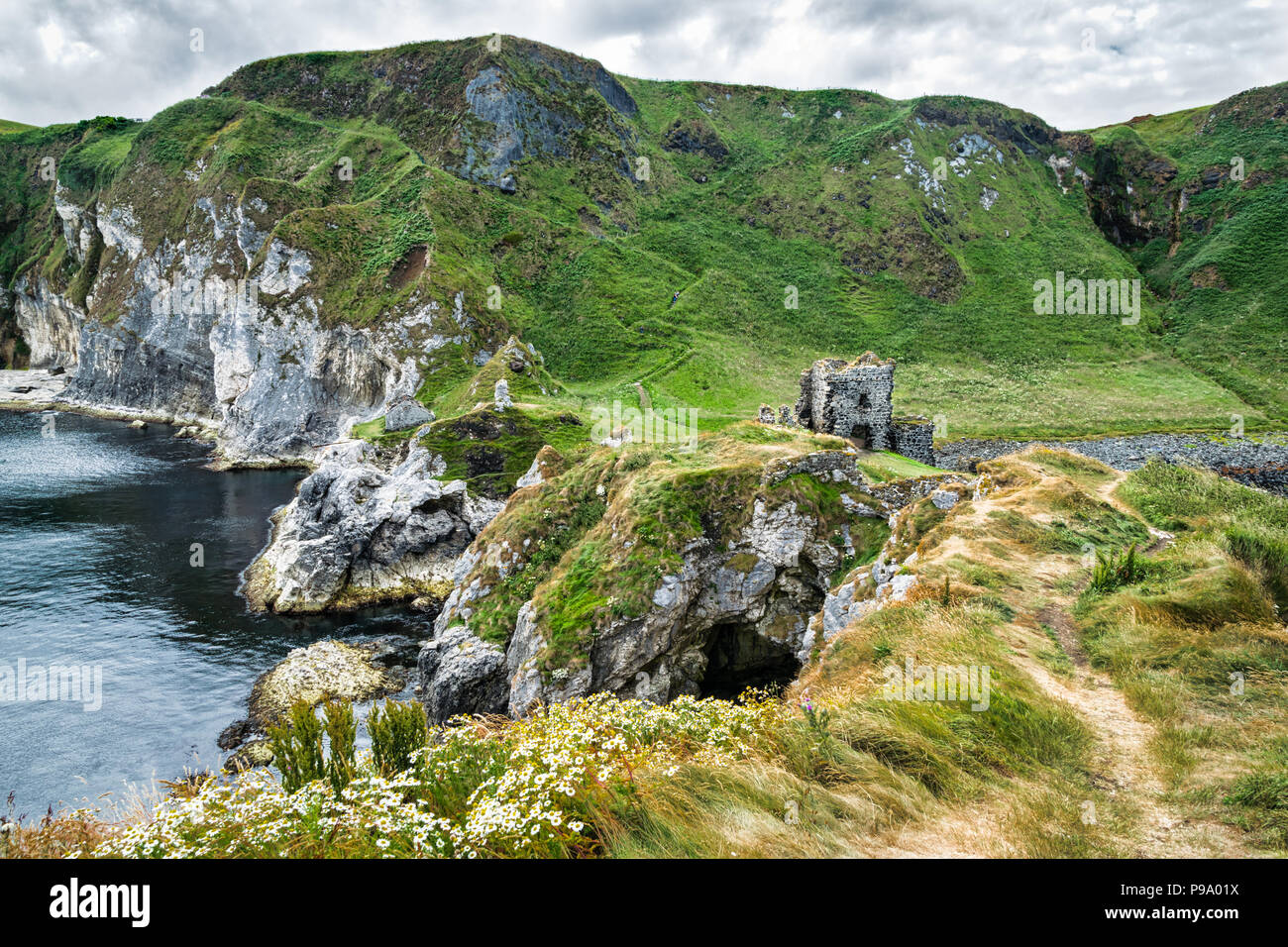 Thi is Kinbane Castle which was built on a small peninsula of sea cliffs that protrude into the Atlantic Ocean close to the town of Ballycastle in Nor Stock Photo