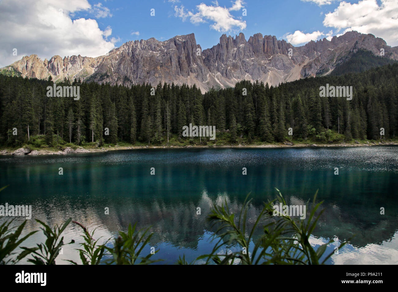 The Latemar Mountains and Lake Carezza, Dolomites, Italy Stock Photo