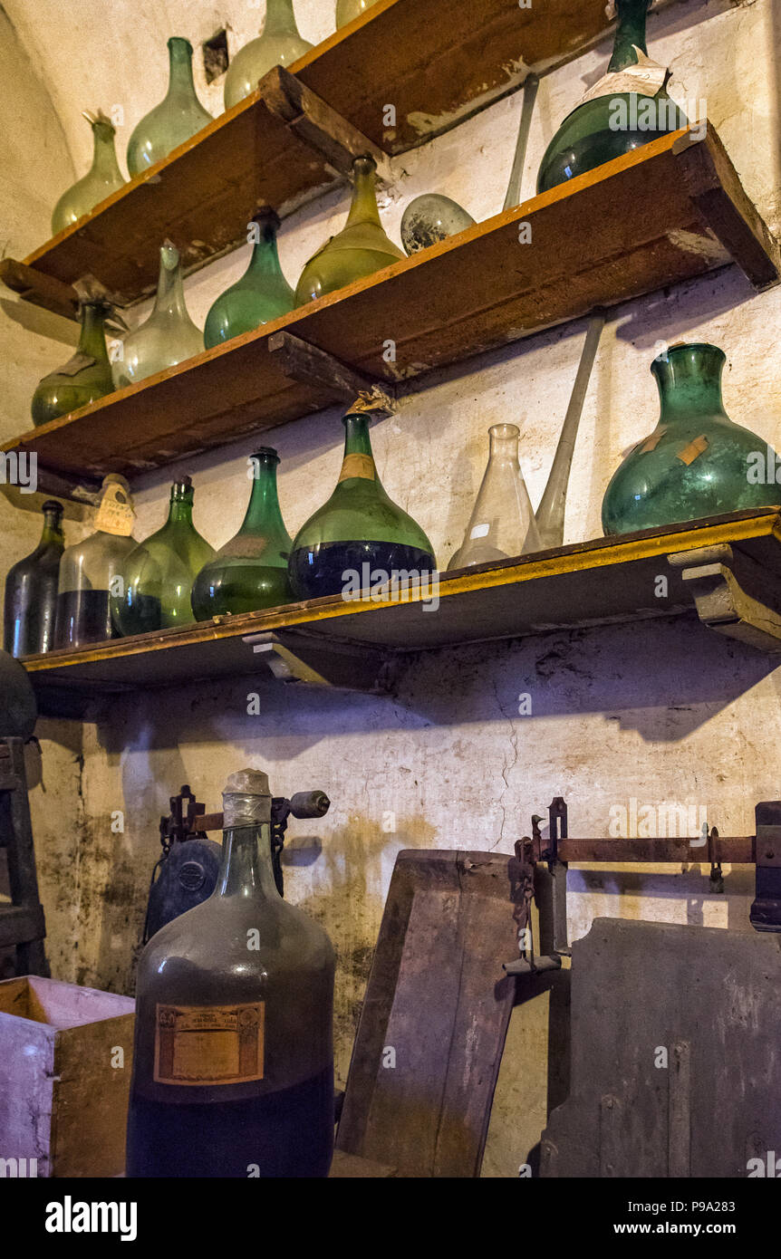 Shelf with flasks in a laboratory of the old Pharmacy and Apothecary 'Farmacia di S. Maria della Scala' in Piazza della Scala in Trastevere quarter, Rome, Italy Stock Photo