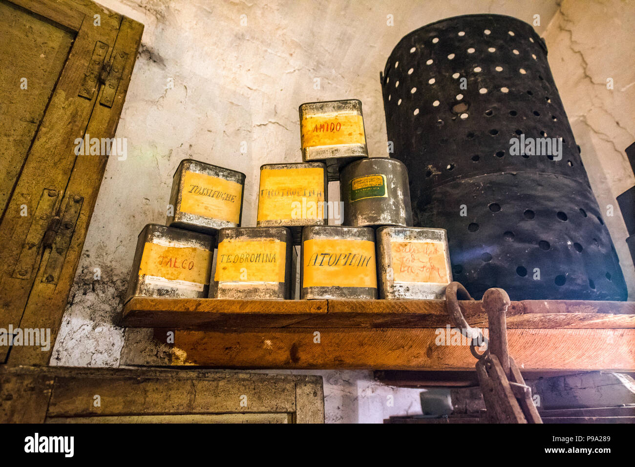 Shelf with boxes containing ingredients in a laboratory of the old Pharmacy and Apothecary 'Farmacia di S. Maria della Scala' in Piazza della Scala in Trastevere quarter, Rome, Italy Stock Photo