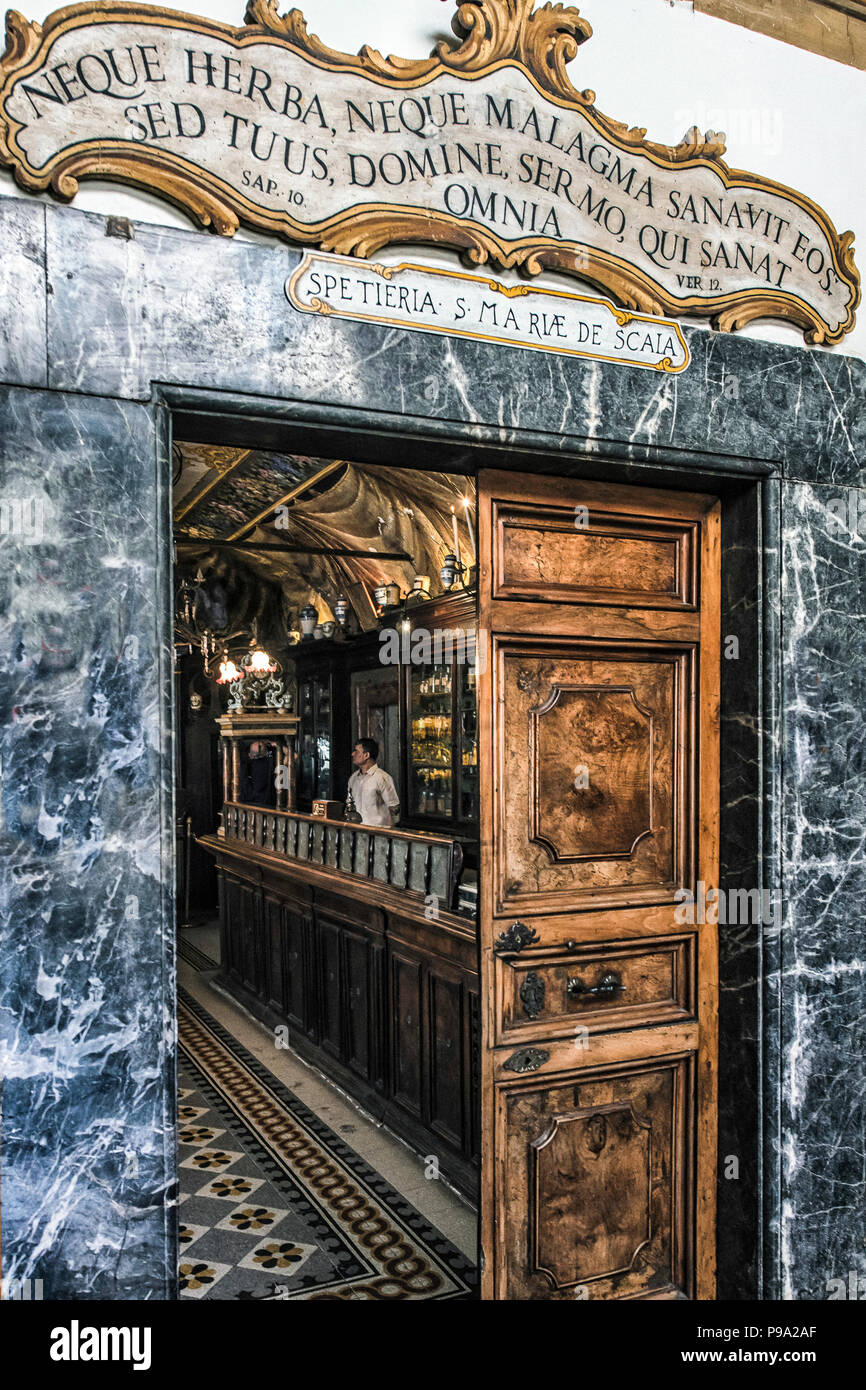 The entrance of the old Pharmacy and Apothecary 'Farmacia di S. Maria della Scala' in Piazza della Scala in Trastevere quarter, Rome, Italy Stock Photo