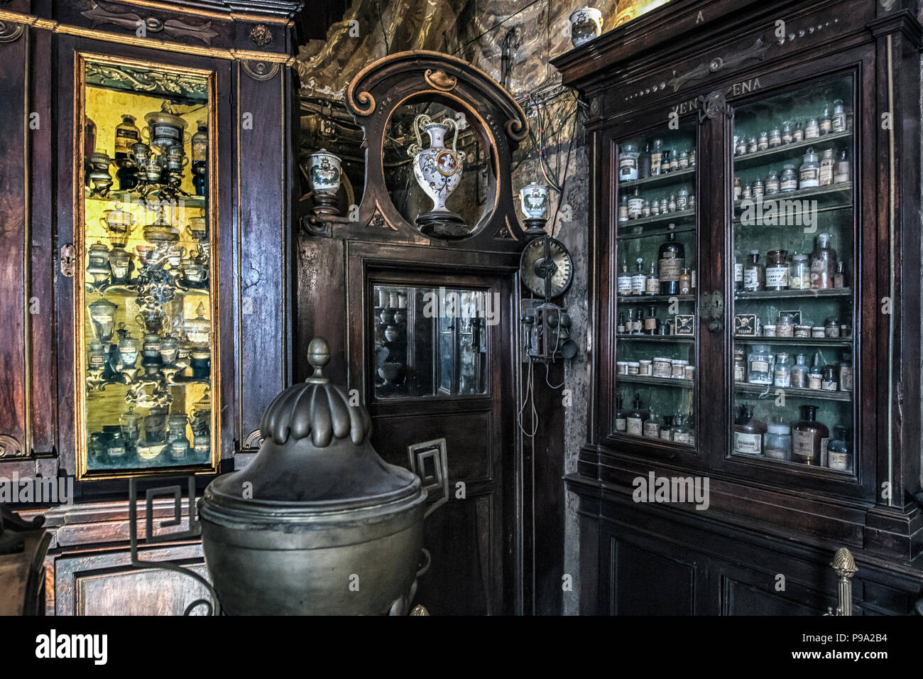 Cabinets containing medicines and oils in the principal hall of the old Pharmacy and Apothecary 'Farmacia di S. Maria della Scala' in Piazza della Scala in Trastevere quarter, Rome, Italy Stock Photo