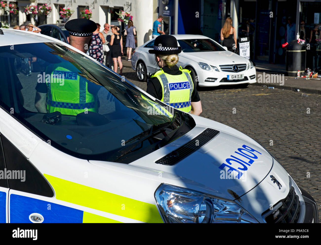 Police and police van, Ulverston, Cumbria, England UK Stock Photo