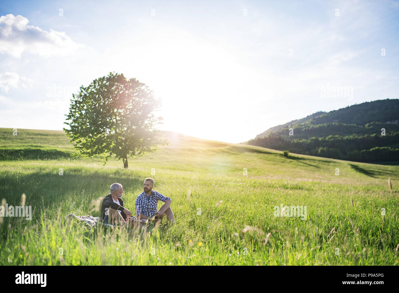 Father son talking sitting hi-res stock photography and images - Alamy