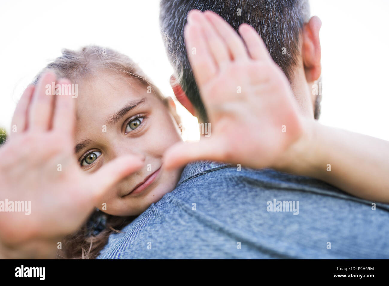 Father with a small daughter having fun in spring nature. Stock Photo