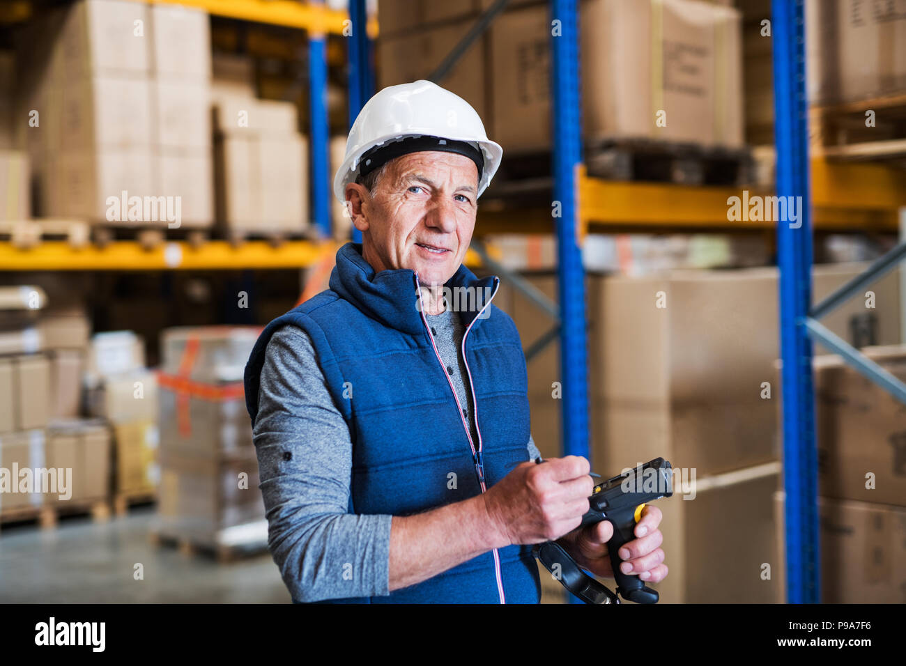 Portrait of a senior male warehouse worker or a supervisor Stock Photo ...