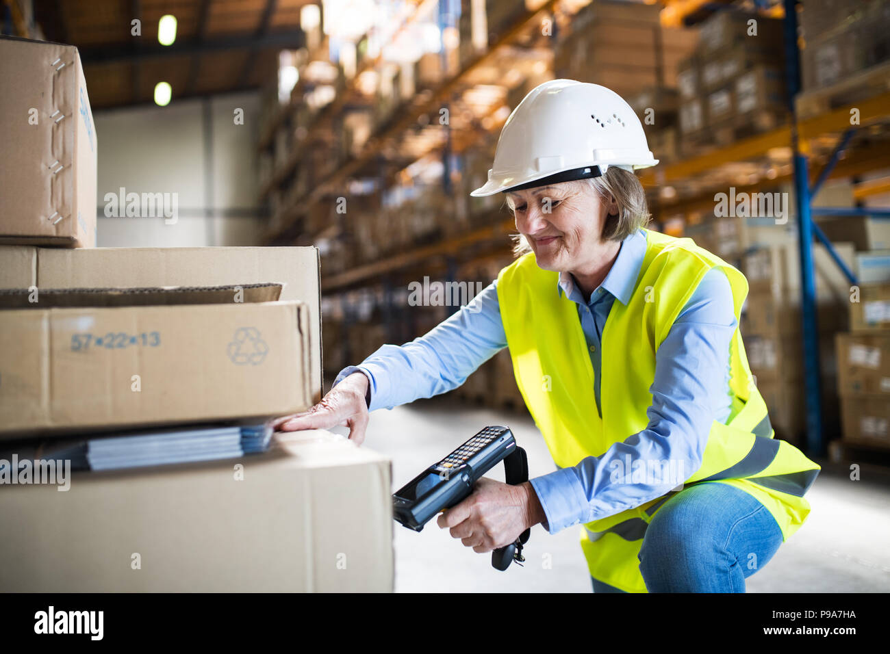 Using handheld scanner warehouse hi-res stock photography and images ...