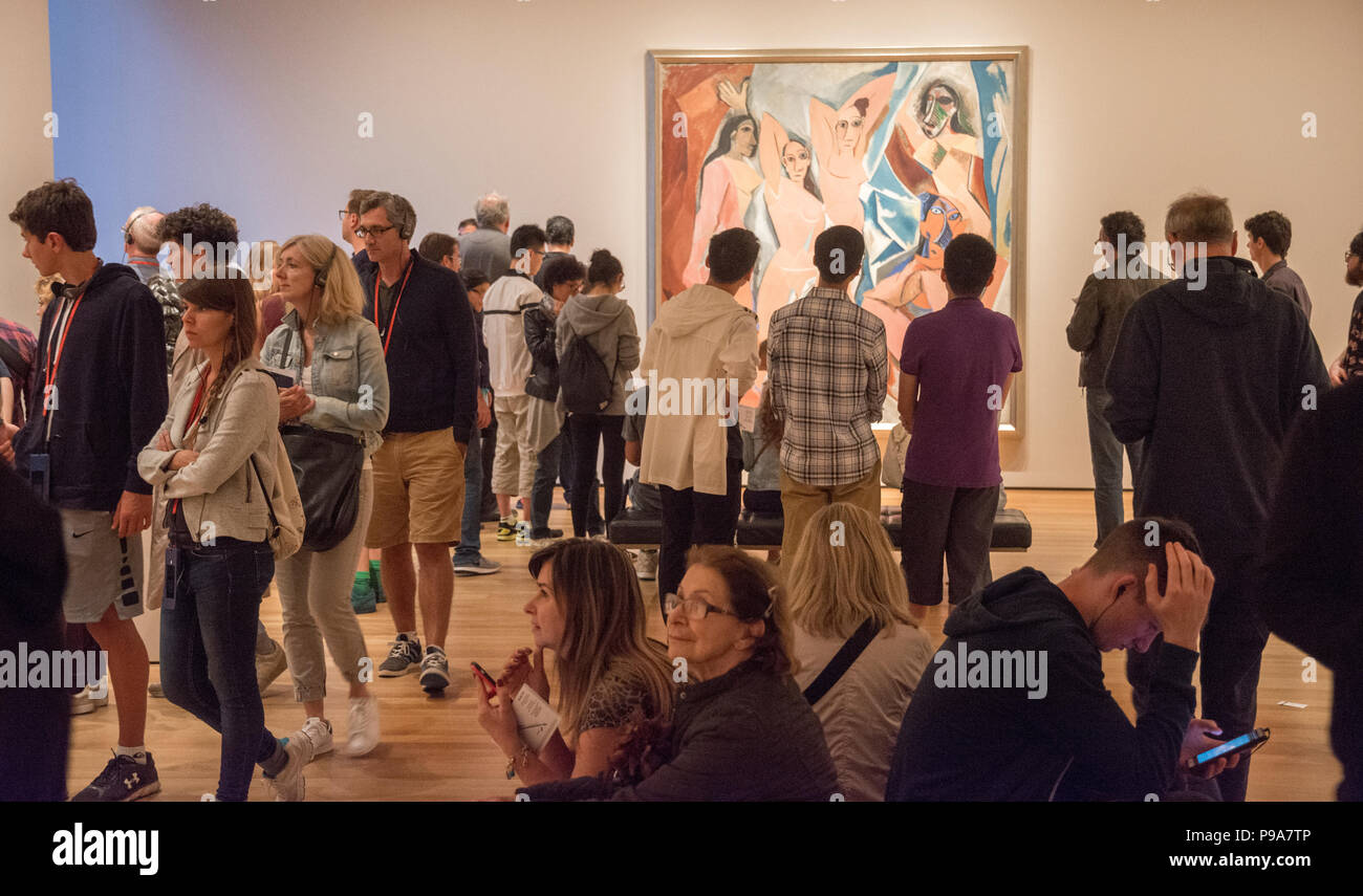 Visitors crowd the Museum of Modern Art on a Tuesday afternoon. Picasso’s early masterwork, “Les Demoiselles d'Avignon” is at rear. Stock Photo