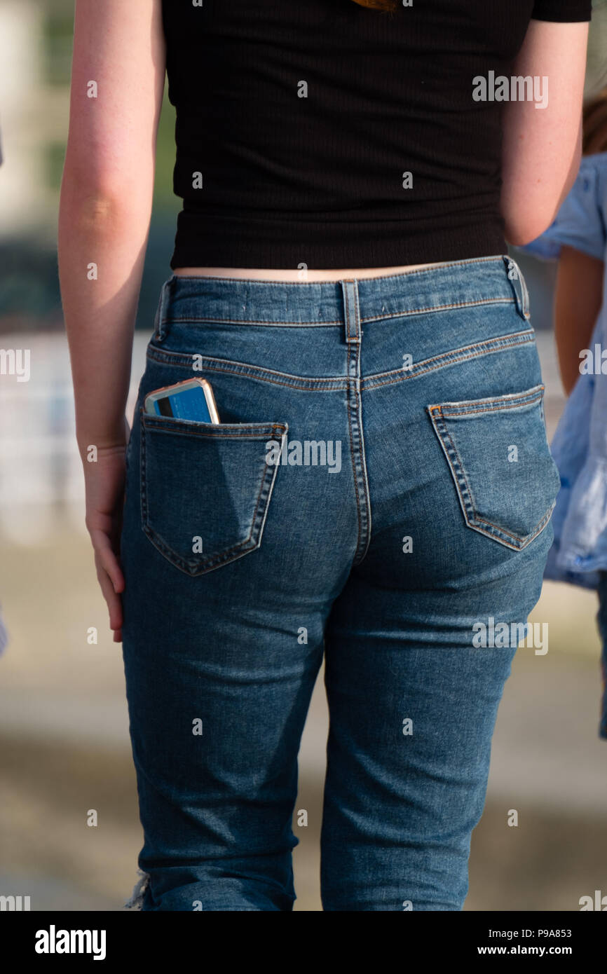 Girl phone jeans back pocket hi-res stock photography and images