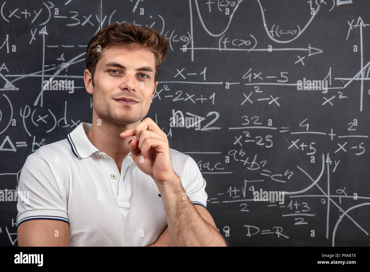 young teacher portrait and blackboard background Stock Photo Alamy