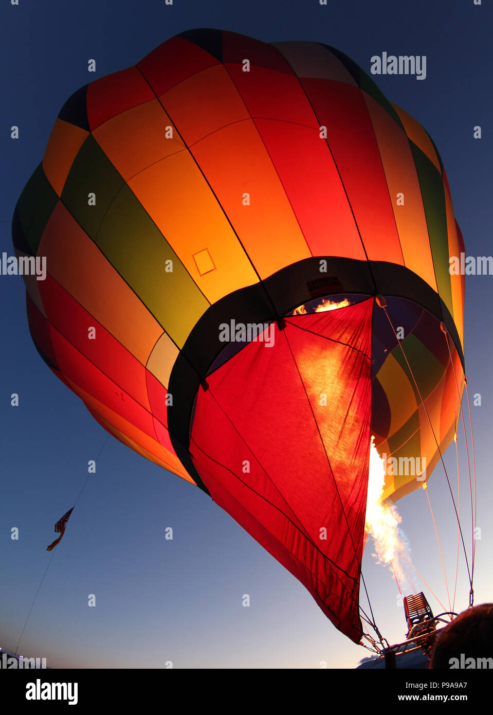 A hot air balloon getting inflated for early morning flight at the Albuquerque balloon festival, New Mexico Stock Photo